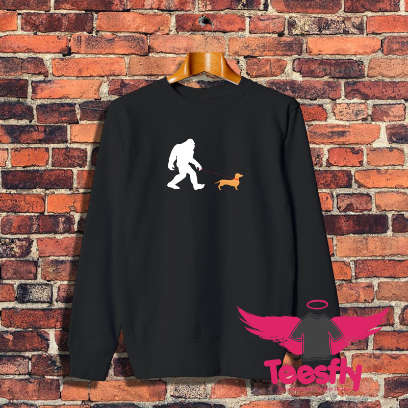 Bigfoot walking a daschund Sweatshirt 1